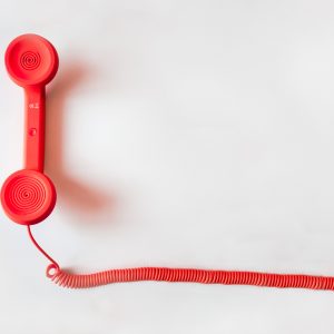 old-school red phone on white background